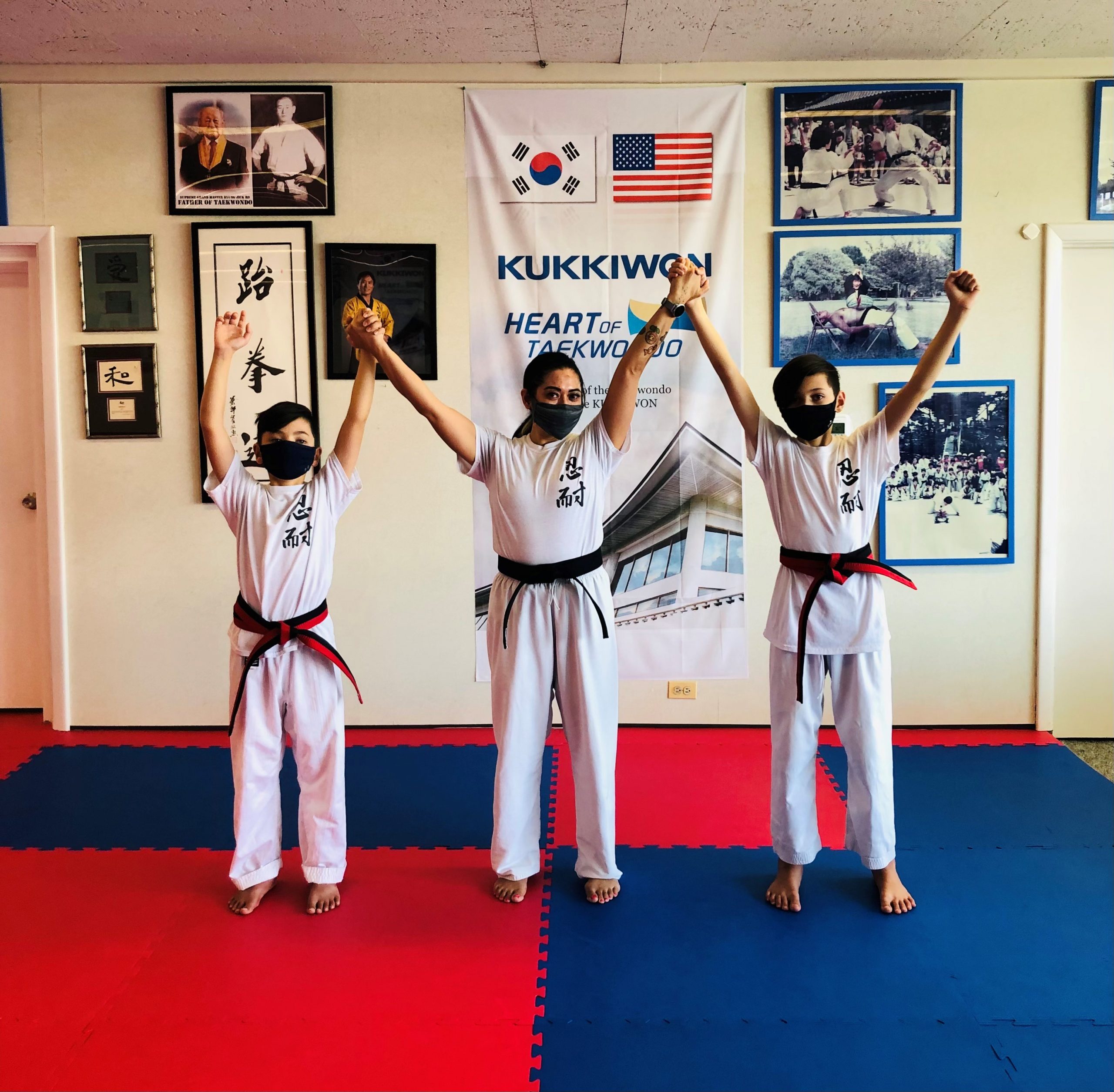 Martial Arts Students Raise Hands